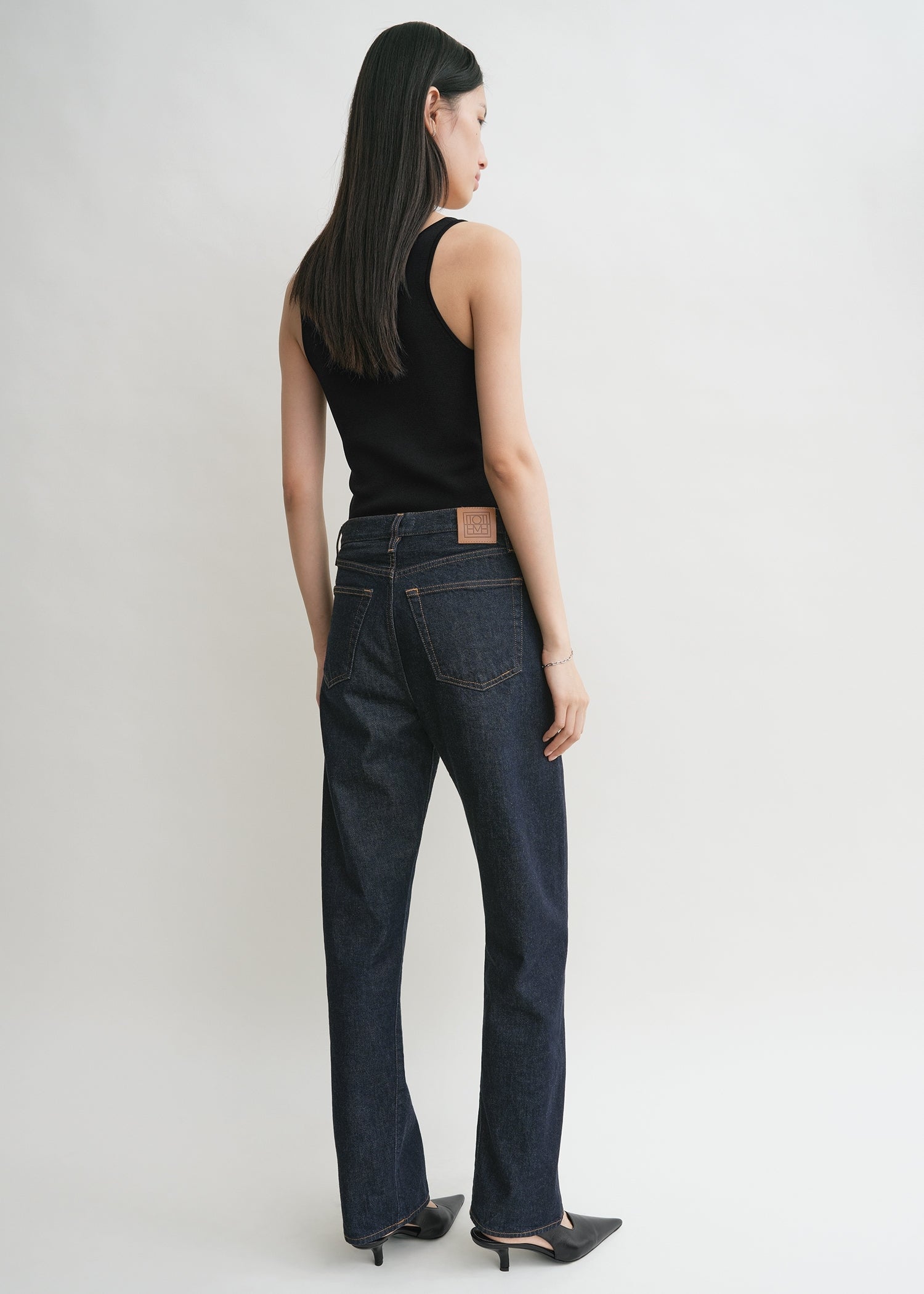 Twisted seam denim full length rinsed blue