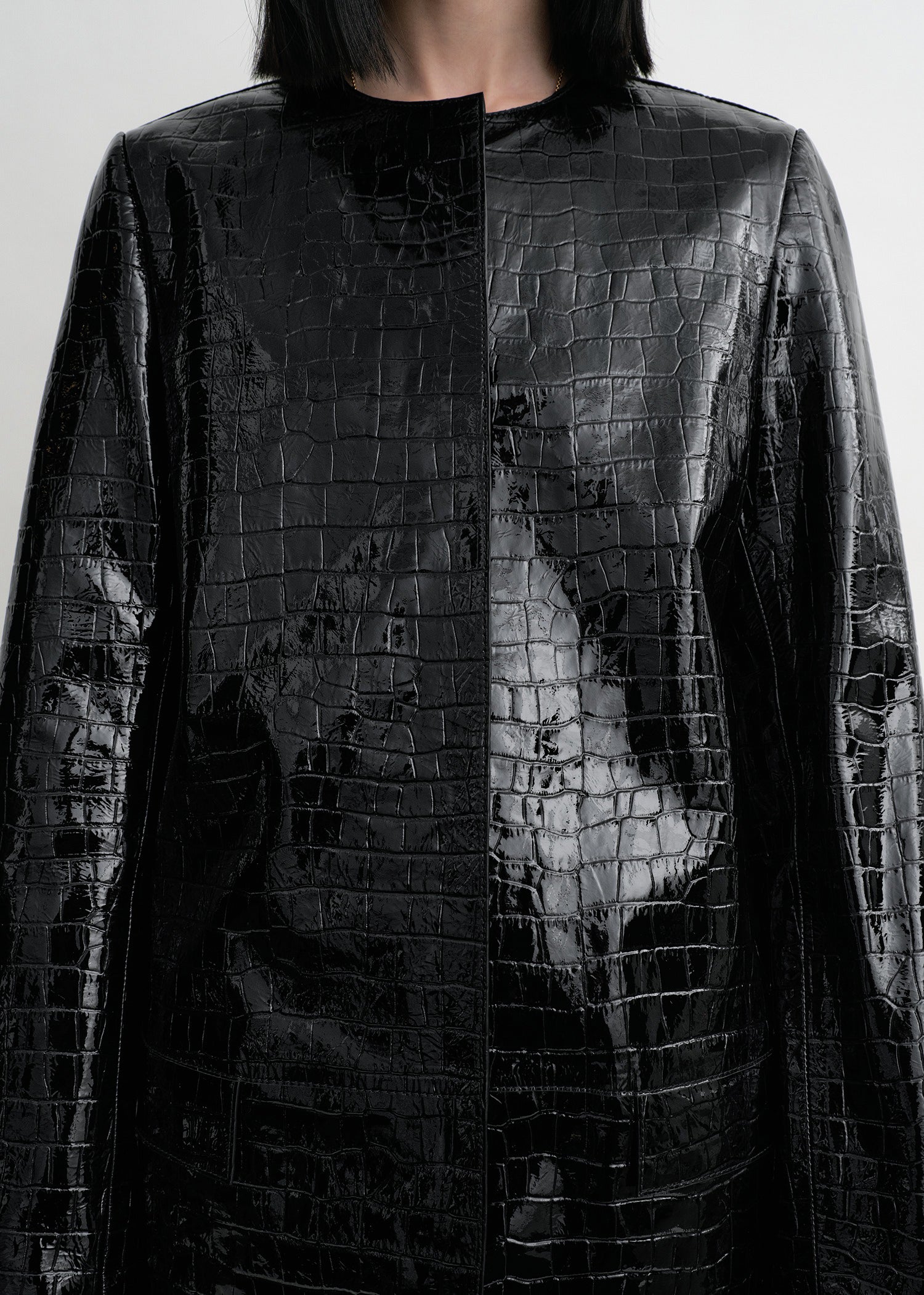 Croco-embossed coat black