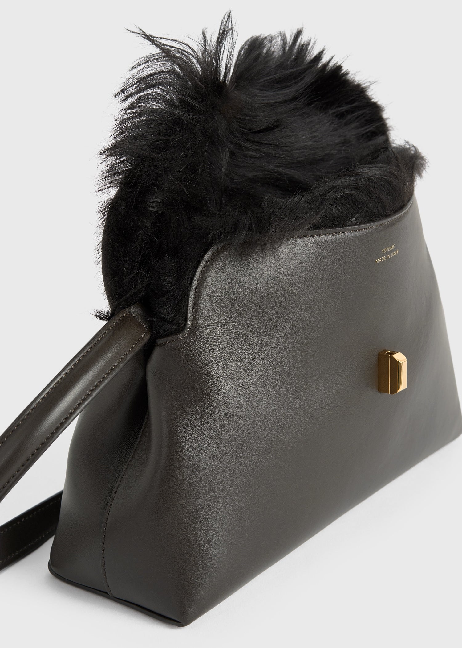 Shearling T Lock clutch bark TOTEME